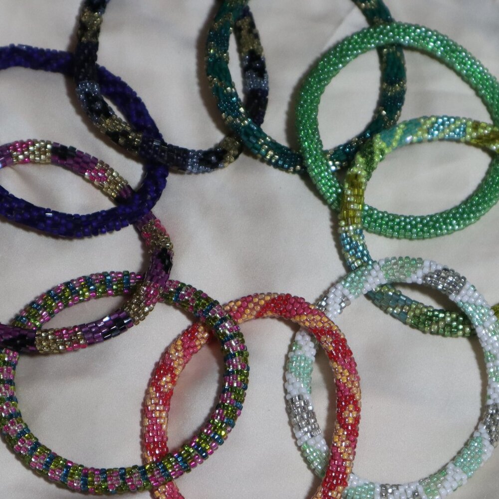 9 Lily and Lauras and a look alike handmaid red and white beaded bracelet